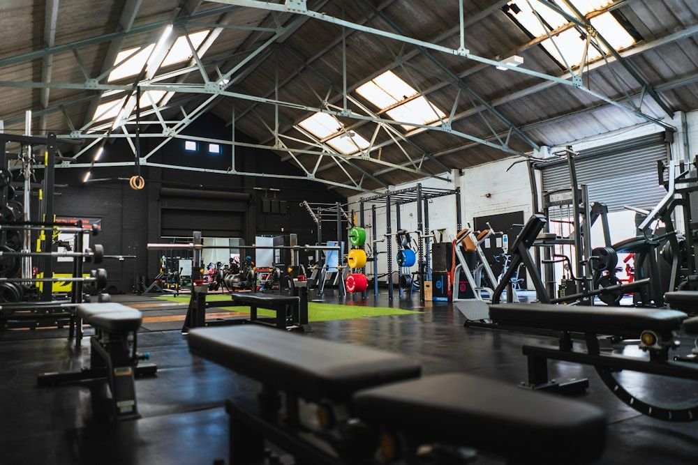 The main gym floor with benches, racks and open training space