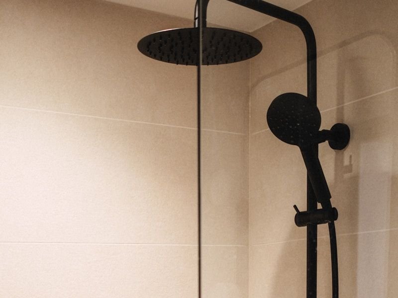 Private shower cubicle with matte black fittings