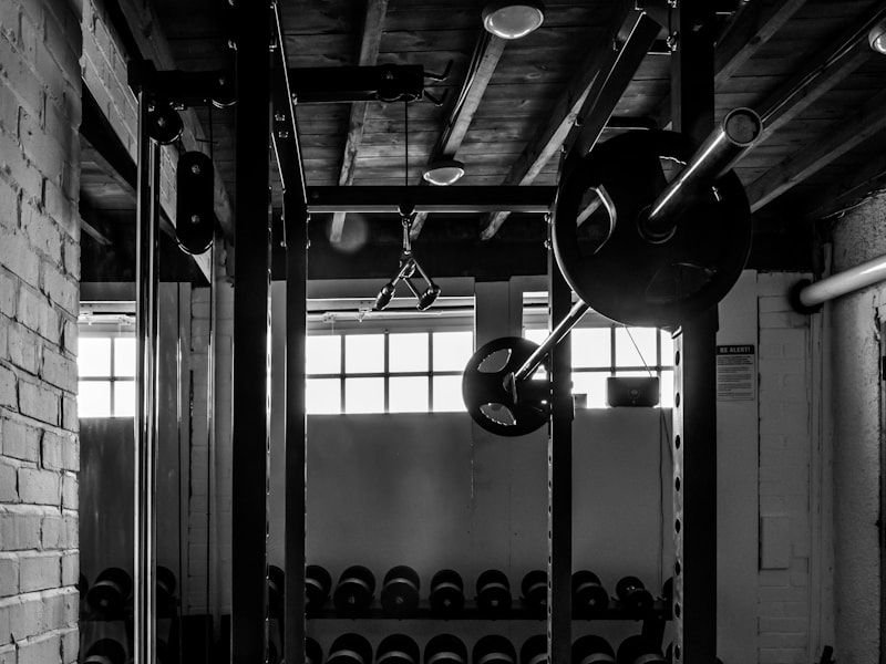 Strength area with squat racks and loaded olympic barbells
