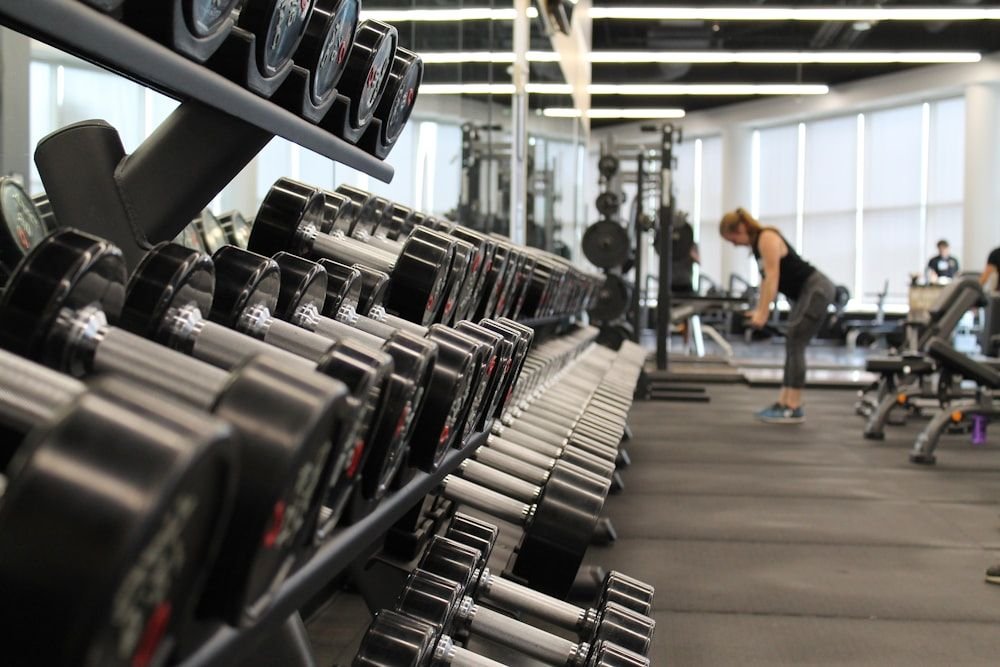 Dumbbell rack running the length of the free-weight area