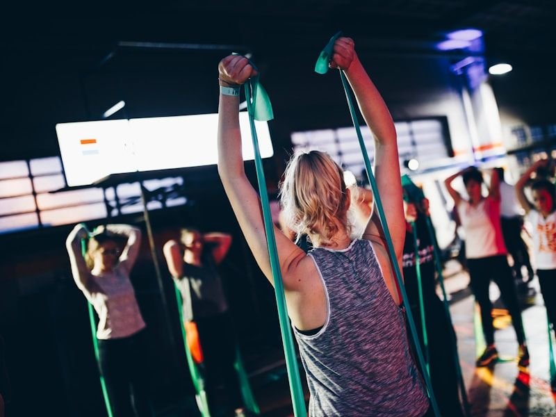 Group Training at FITZONE — Group class training together with weights overhead